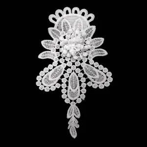 Detailed close-up of white milk silk water-soluble lace embroidery flower patch