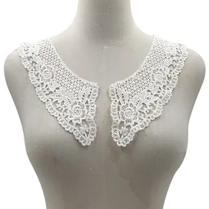 Detailed view of white cotton lace embroidery fake collar on a mannequin torso
