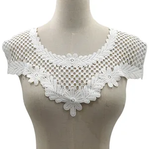 Detailed view of white water-soluble lace embroidered collar with floral pattern