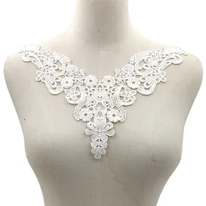 Close-up of white water-soluble hollow embroidery lace collar on a mannequin