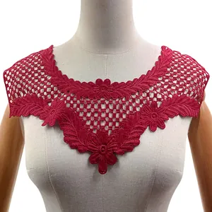Detailed view of red water-soluble lace collar with intricate floral embroidery patterns