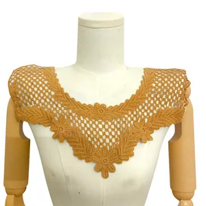 Close-up detail of a brown floral water-soluble lace collar with intricate 3D embroidery