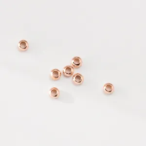 Macro detail of rose gold 925 silver plated abacus spacer beads for jewelry DIY projects.