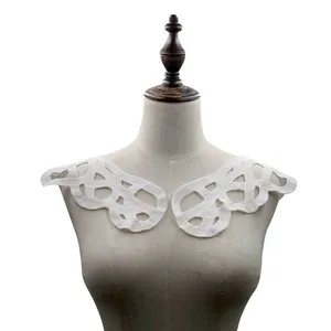 Detailed view of white water-soluble lace collar on a mannequin for DIY crafts.