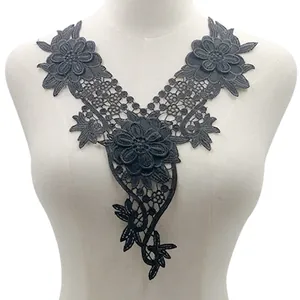 Close-up of black water-soluble embroidered lace collar applique on mannequin