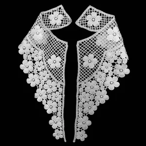 Macro view of white water-soluble lace collar with delicate 3D hollow floral embroidery details