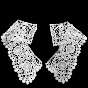 Detailed view of white water-soluble lace collar with 3D hollow embroidery design