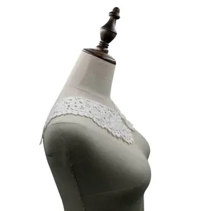 Detailed view of white water-soluble lace collar accessory for DIY clothing crafts