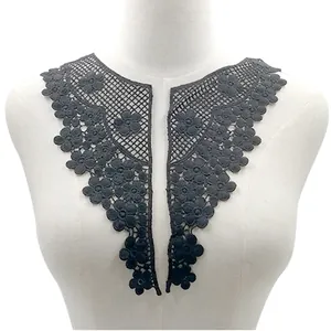 Detail of black floral water-soluble lace collar applique for DIY sewing projects.