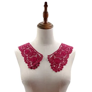 Detailed view of magenta 3D water-soluble lace floral collar on a mannequin bust