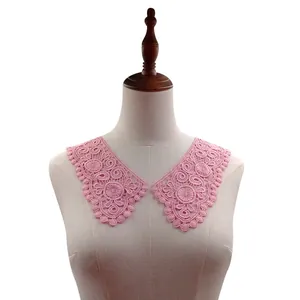 Detailed close-up of pink water-soluble milk silk lace collar displayed on mannequin