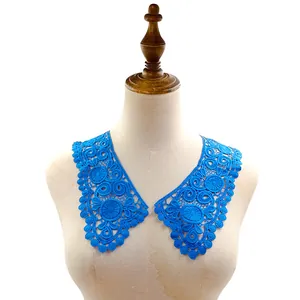Close-up of bright blue water-soluble lace collar patches for DIY clothing decoration