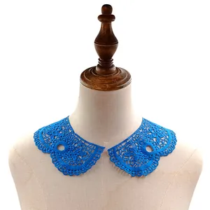 Detailed view of bright blue water-soluble lace collar with intricate hollow embroidery
