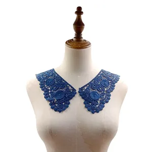 Detailed view of 3D hollow blue embroidered lace collar displayed on a mannequin torso