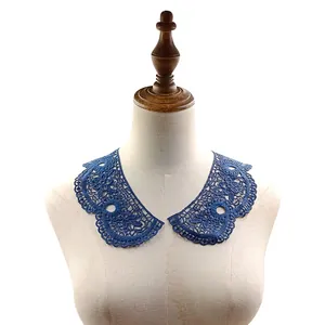 Detailed view of the blue water-soluble embroidered lace collar on a mannequin torso