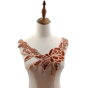 Detailed view of brown embroidered rose water-soluble lace collar applique on mannequin