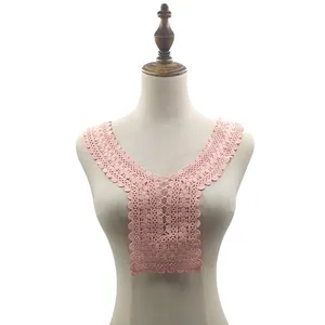 Close-up of pink water-soluble lace collar with intricate embroidery detail