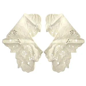 Detailed view of white cotton eyelet embroidered lace collar appliques for DIY crafts