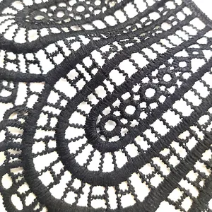 Detailed texture of black milk silk water-soluble lace with hollow floral pattern