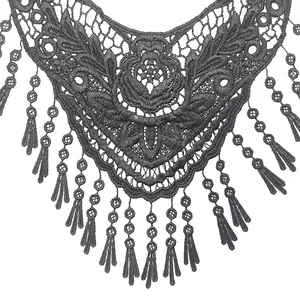 Intricate black water-soluble lace collar with floral embroidery and tassel detail