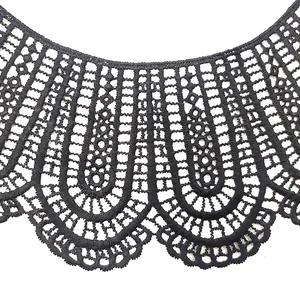 Detail macro view of black milk silk water soluble lace embroidery fake collar pattern.