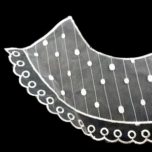 Detailed macro view of white embroidered lace organza collar for DIY clothing projects