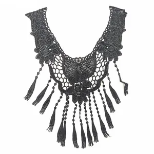 Intricate detailed view of black water-soluble embroidered lace false collar with fringe tassels