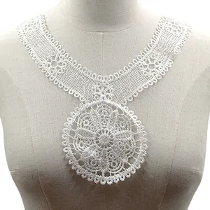 Close-up of white water-soluble lace collar with intricate hollow floral design