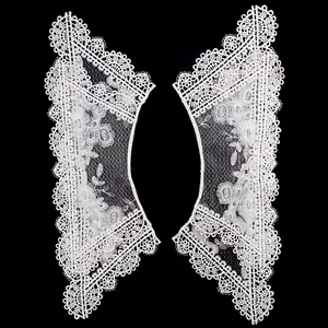 Détail des appliques d'épaules en dentelle brodée ajourée blanche de haute qualité