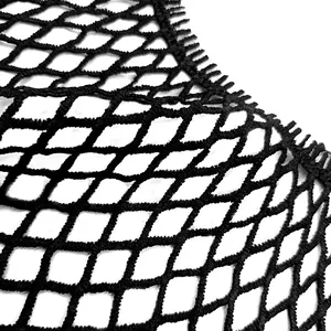 Close-up macro view of black water-soluble lace fabric with large diamond mesh pattern