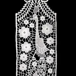 Close-up detail of white milk silk water-soluble lace collar with peacock floral pattern