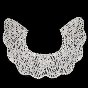 Detailed close-up showing the intricate texture of a white embroidered lace fake collar