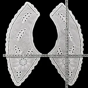 Detailed view of white embroidered cotton hollow-out lace fake collar with measurement rulers