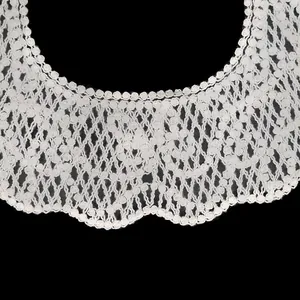 Detailed close-up of white floral embroidered lace shawl collar accessory for DIY sewing