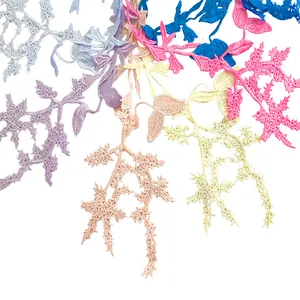 Detailed macro view of colorful water-soluble embroidered lace floral appliques