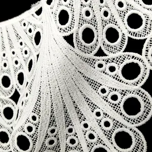 Close-up macro detail of white water-soluble lace with 3D embroidery flower pattern
