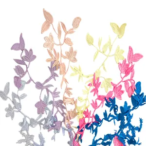 Detailed macro view of colorful water-soluble lace floral embroidery appliques for DIY crafts