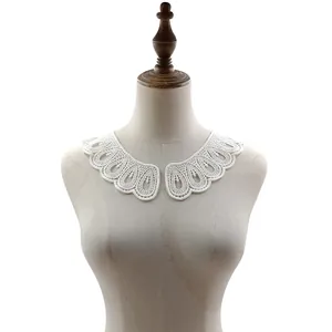 White water-soluble lace collar with intricate floral embroidery on a mannequin