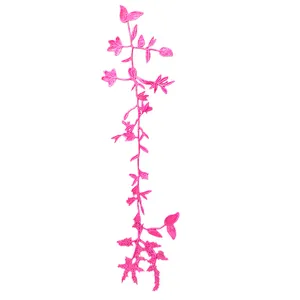 Detailed macro view showing textures of pink water-soluble floral lace embroidery applique