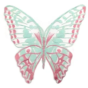 Detailed view of a mint green and pink butterfly embroidered lace applique patch