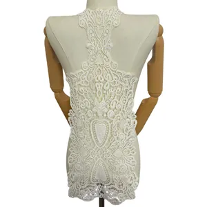 Close-up detail of white milk silk water-soluble lace back neckline on a mannequin