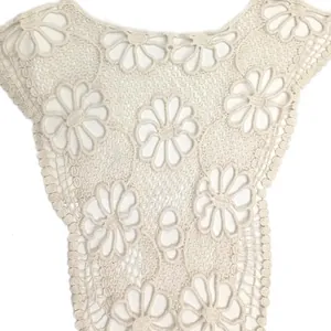 Close-up detail of cotton embroidered floral lace fake collar with hollow design