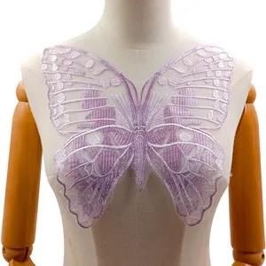Detailed shot of lavender butterfly embroidery lace patch displayed on a mannequin