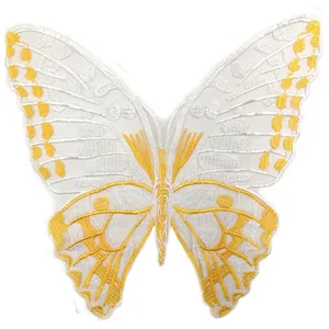 Detailed view of exquisite white and gold butterfly embroidery patch with water-soluble mesh