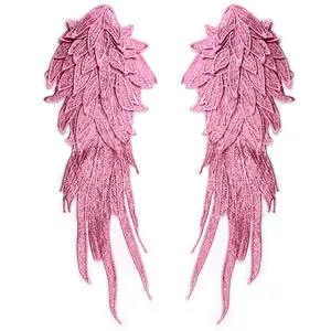Close-up detail of heavy-duty pink embroidered angel wings water-soluble lace patches