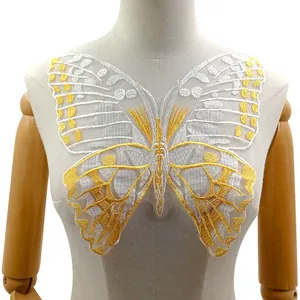 Detailed view of a yellow and white butterfly embroidery patch on a mesh base