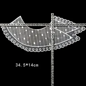 Close-up detail of white embroidered lace collar with size measurements 34.5x14cm