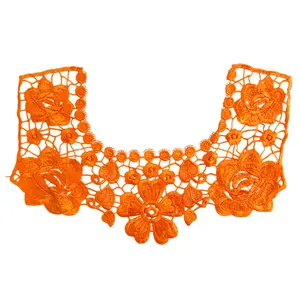 Macro view of bright orange 3D hollow embroidered lace collar with floral patterns.