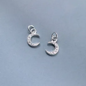 Pair of sterling silver crescent moon charms with sparkling CZ stones for DIY jewelry making.