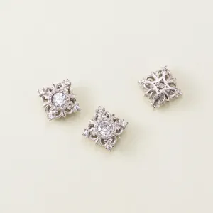 Detailed view of three 925 sterling silver square spacer beads with sparkling cubic zirconia